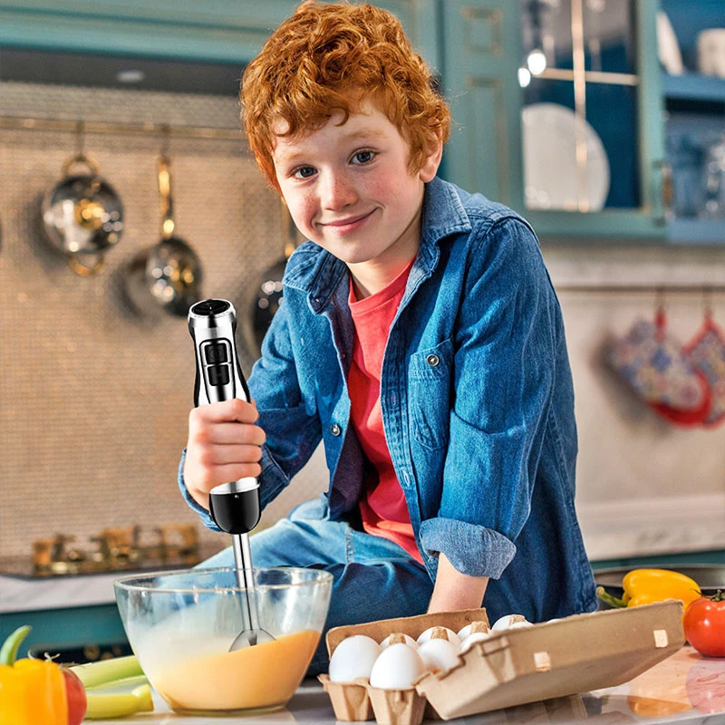 boy using hand blender