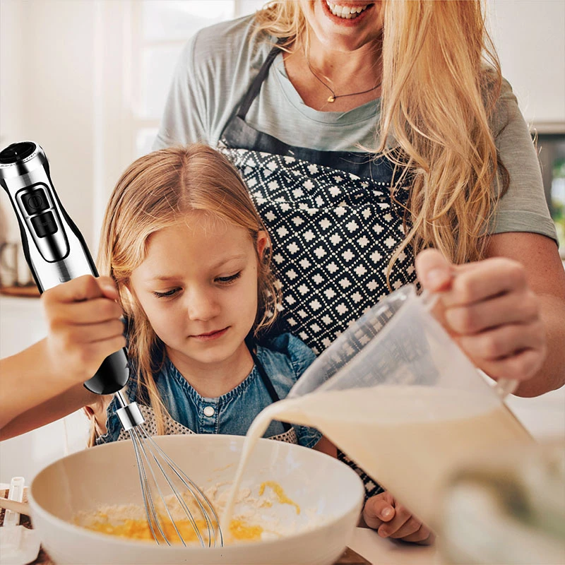 mother and daughter using hand blender